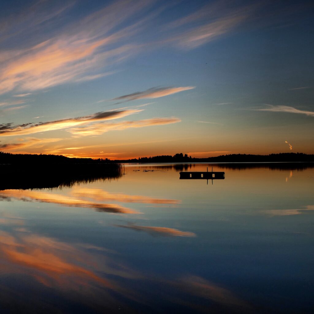 Photo of sunset reflecting on the water in the Kvarken Archipelago by Mårten Björkgren.