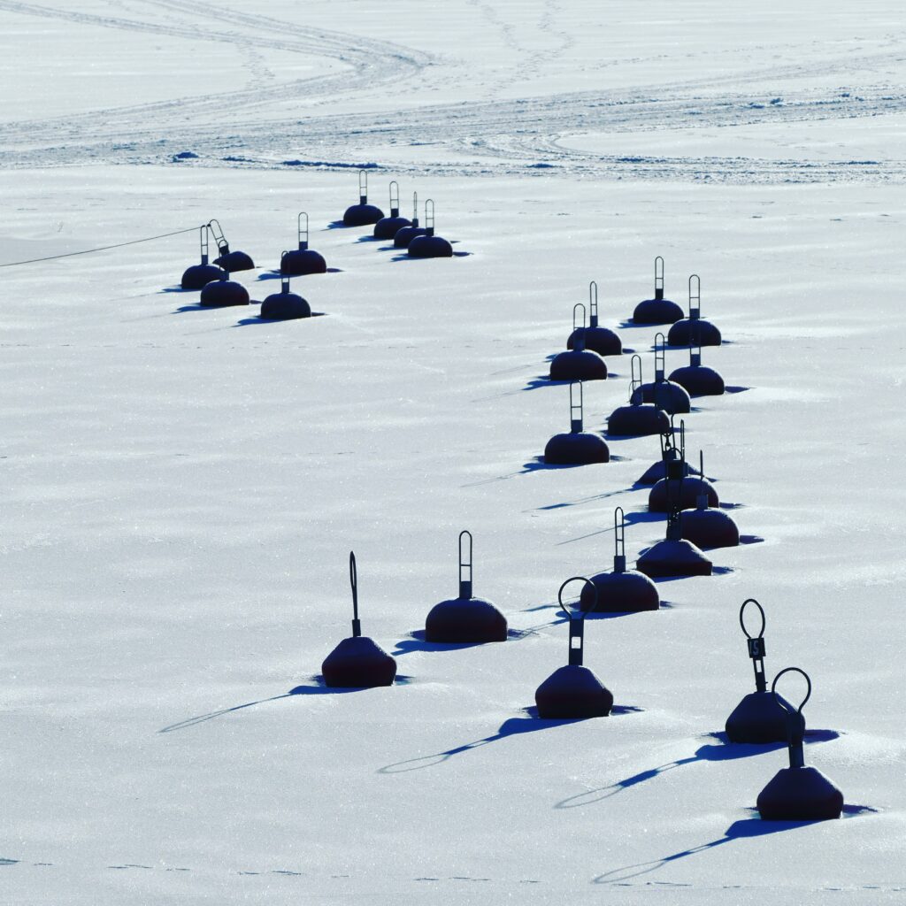 Photo of buoys frozen in the sea in the Kvarken Archipelago by Mårten Björkgren.
