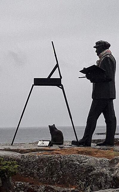 Sculpture of a painter and a cat on Kobba Klintar